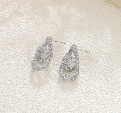 Boucles d'oreilles Agathe argentées – doubles cercles texturés et scintillants en acier inoxydable 316L – FLIDEA